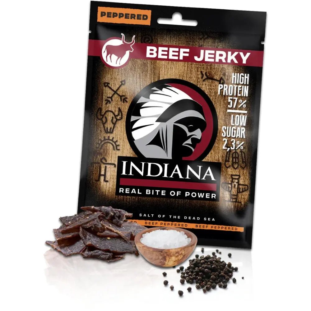 Pakirana goveđa jerky grickalica s paprom, komadići i zrnca bibera uz vrećicu